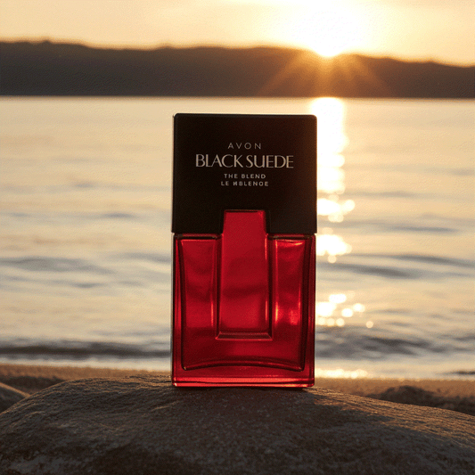 Avon Black Suede men's eau de toilette bottle with sunset over water background
