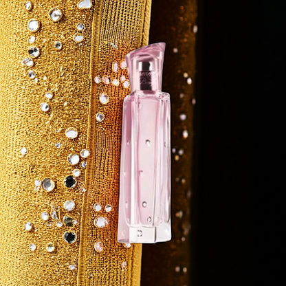 Pink Dreamlife Bouquet Eau De Perfume bottle with sparkling gold background and floral essence design